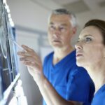Radiologists looking at brain scans